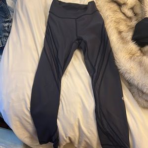 Lululemon navy leggings. Super cute! 7/8 fit. Mesh wrap around. Size 2